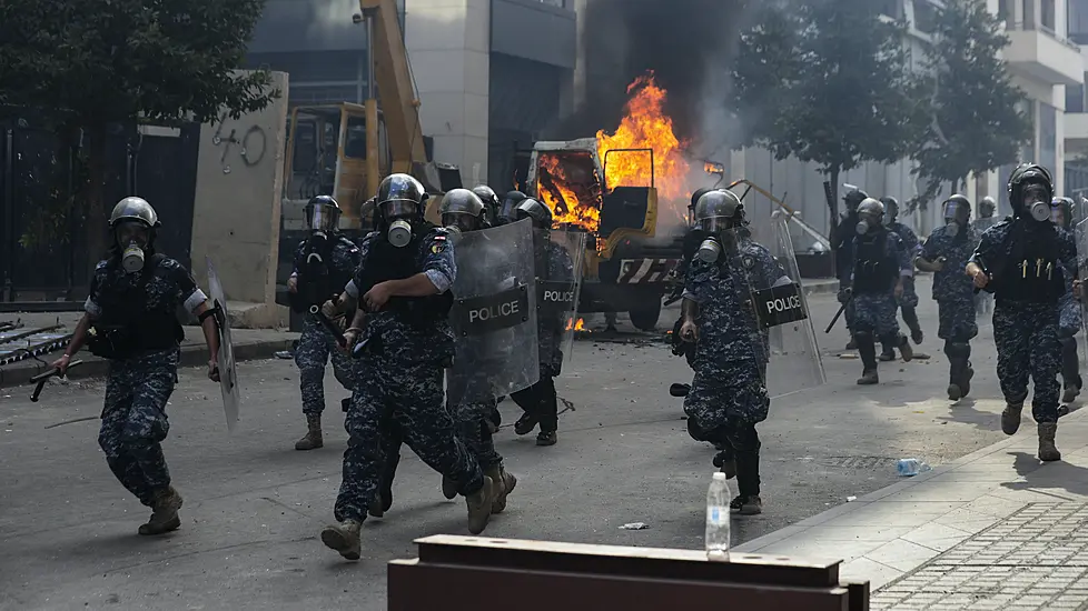 Lebanese Pm Proposes Early Elections Amid Violent Protests