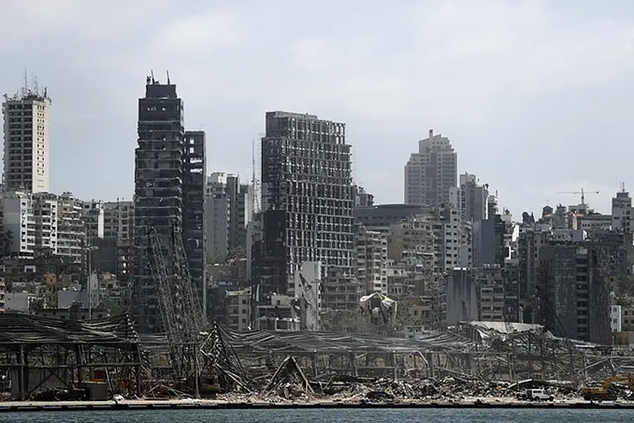 Damaged residential buildings and the destroyed port warehouses at the scene of Tuesday’s explosion (Hussein Malla/AP)