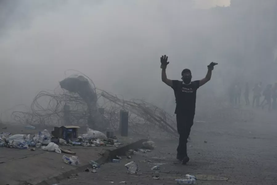 Protesters clashed with police (Hassan Ammar/AP)