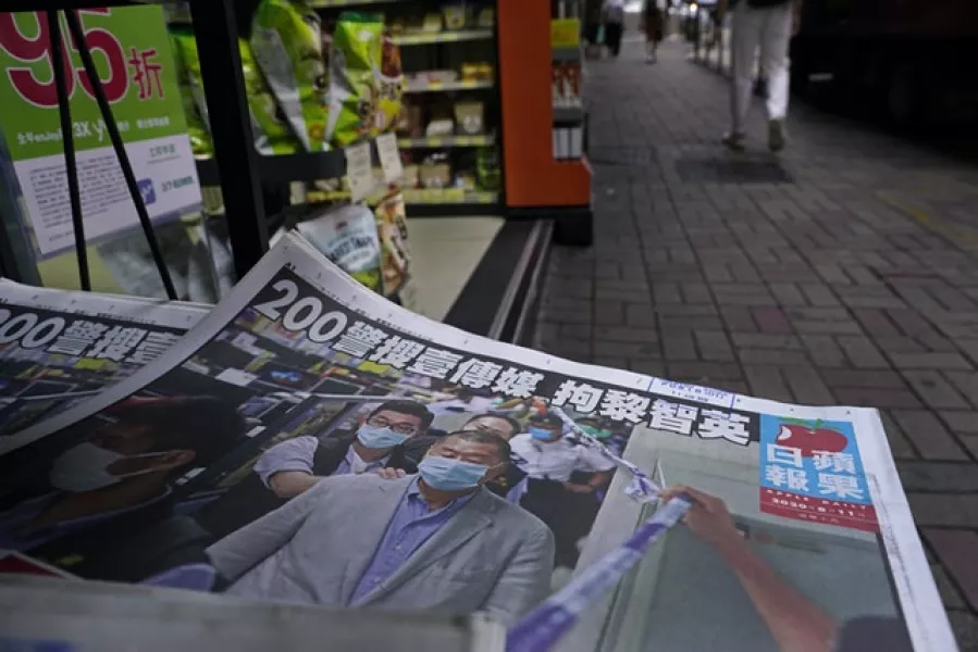 Copies of the Apple Daily newspaper with a front page featuring Hong Kong media tycoon Jimmy Lai (AP/Vincent Yu)