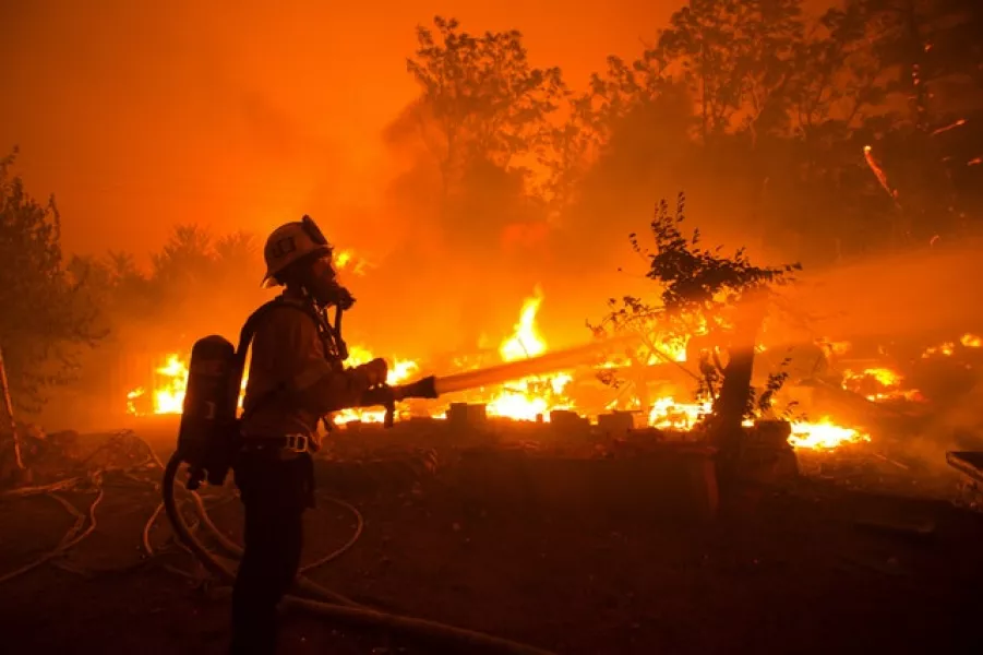 A firefighter works against the Lake Hughes fire (Ringo H.W. Chiu/AP)
