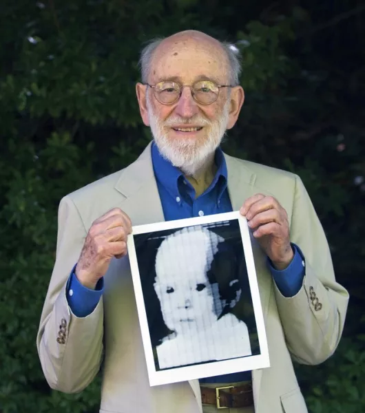 Russell Kirsch holding the image of his son, Walden, that was scanned into the world’s first digital scanner in 1957 (Jamie Francis/The Oregonian via AP, File)