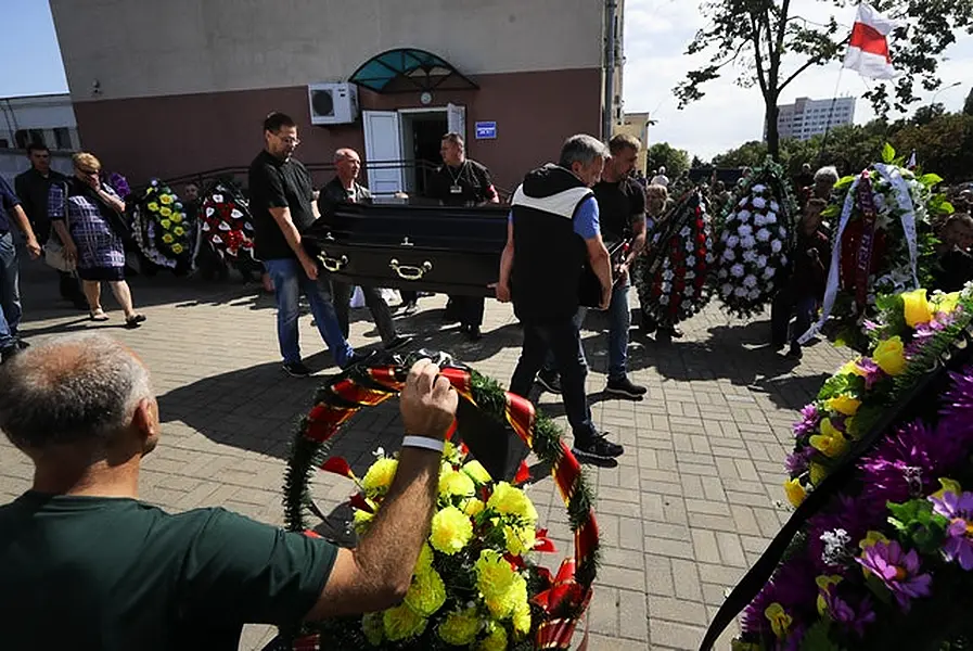 People carry the coffin of Alexander Taraikovsky (Sergei Grits/AP)