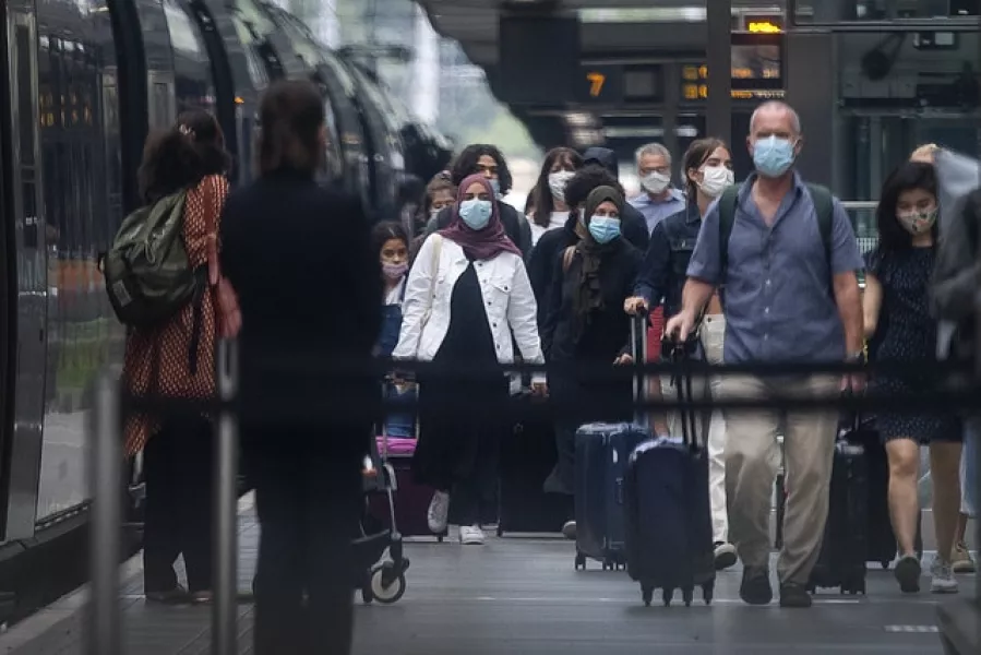 Travellers wearing face masks arrive from Paris to St Pancras on Saturday (Victoria Jones/PA)