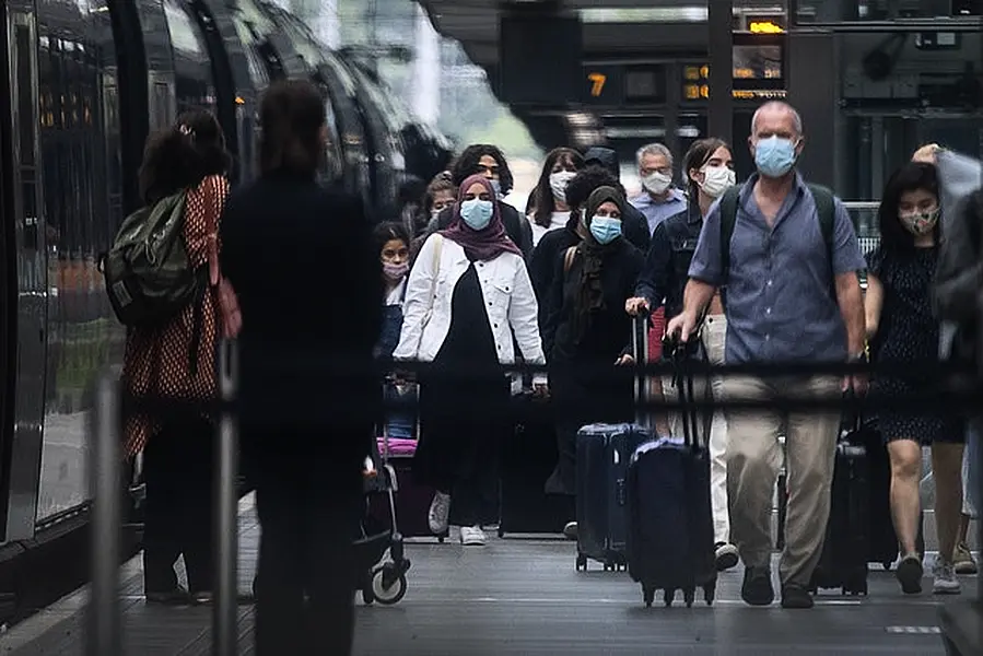 Travellers wearing face masks arrive from Paris to St Pancras on Saturday (Victoria Jones/PA)