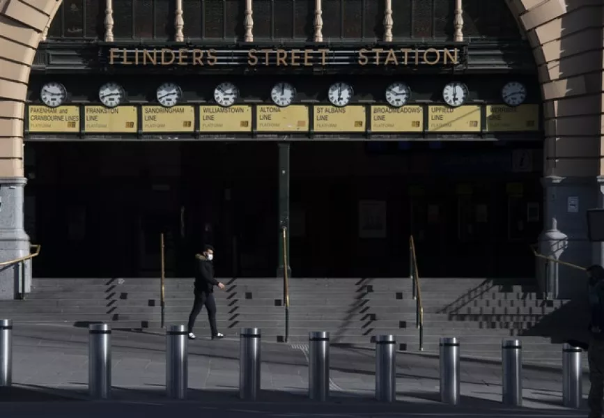 Flinders Street Station in Melbourne is quiet during lockdown (Andy Brownbill/AP)