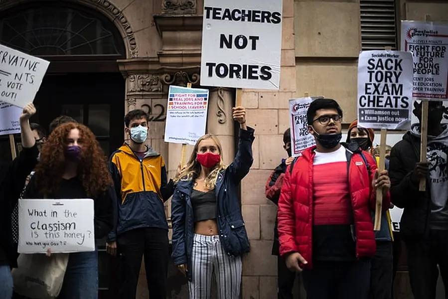 Students wearing face masks take part in a protest in Westminster. Photo: Victoria Jones/PA