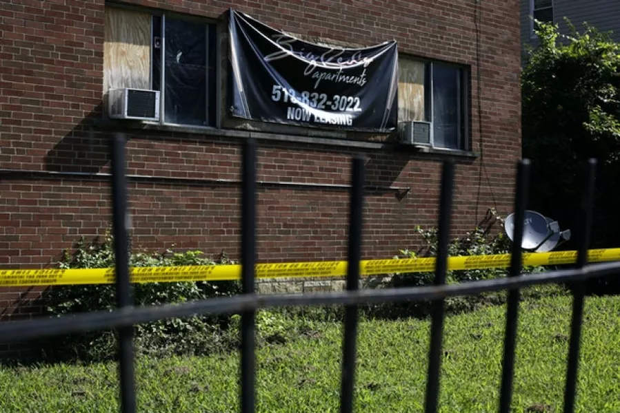 Police tape blocks off the front entrance of the Chalfonte Plaza apartment building at the scene of a shooting in Avondale (Sam Greene/The Cincinnati Enquirer/AP)