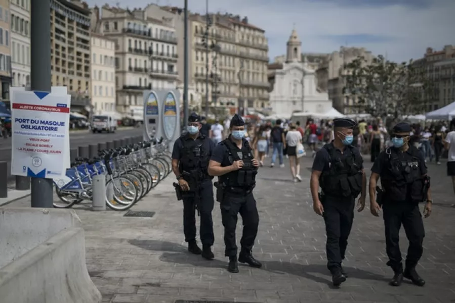 The French government is sending riot police to the Marseille region to help enforce mask requirements (Daniel Cole/AP)