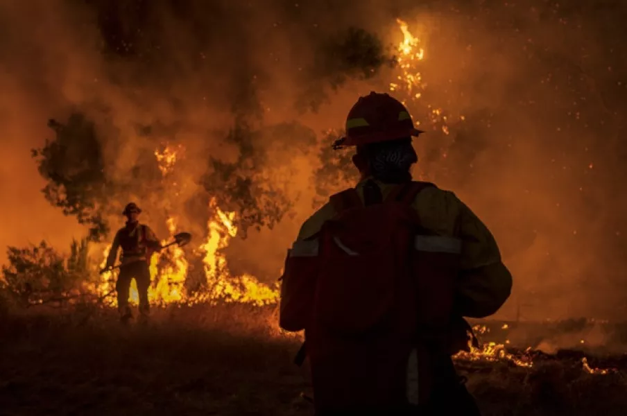 Firefighters at the scene near Carmel Valley, California (Nic Coury/AP)