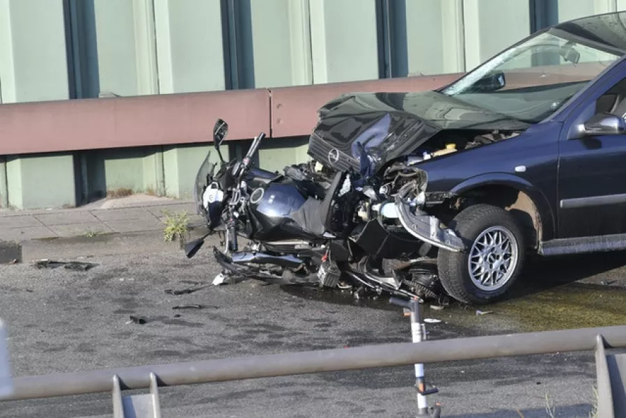 A car and a motorcycle after the incident (Paul Zinken/dpa via AP)