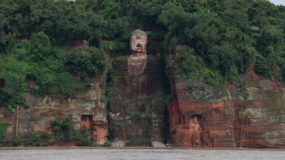 Floodwater Touches Toes Of Famous Buddhist Statue As China Hit By Typhoon