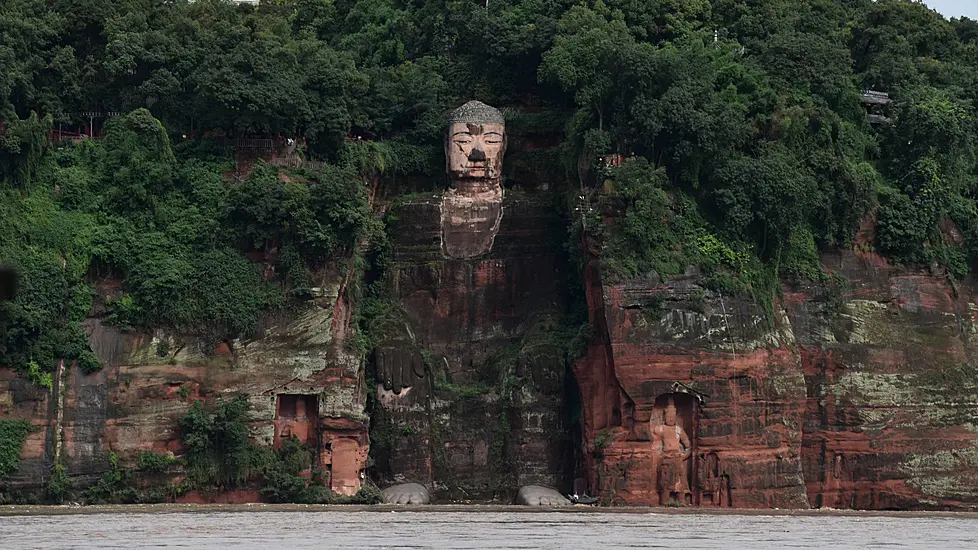 Floodwater Touches Toes Of Famous Buddhist Statue As China Hit By Typhoon