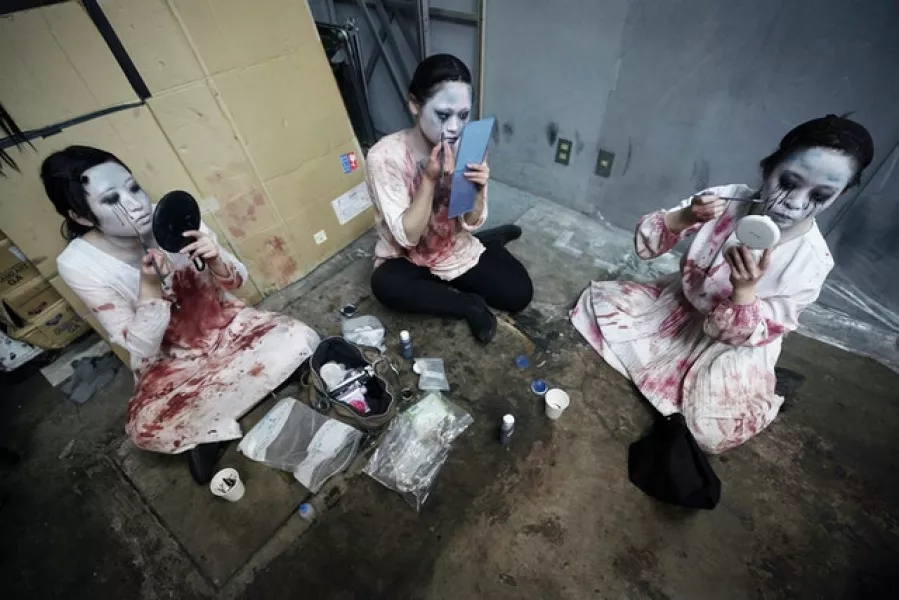 Zombies and ghosts put on their make-up (Eugene Hoshiko/AP)