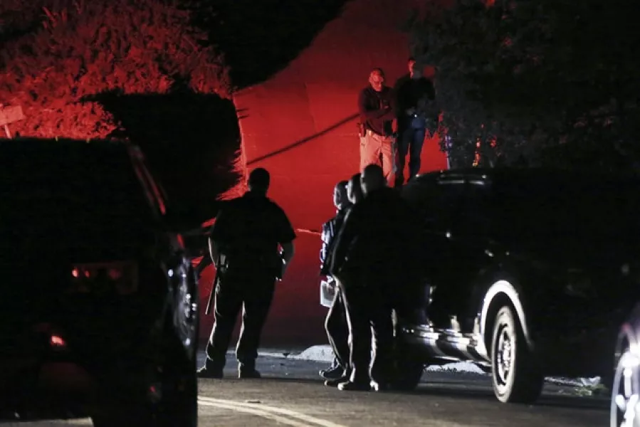 Authorities investigate a multiple shooting on Halloween at an Airbnb rental home in Orinda, California, in 2019 (Ray Chavez/East Bay Times via AP)
