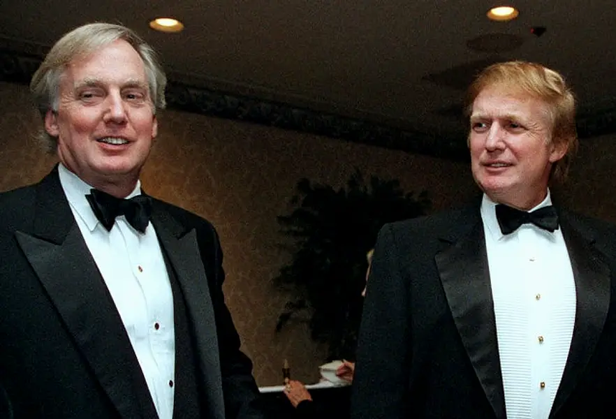 Robert Trump, left, joins then property developer and presidential hopeful Donald Trump at an event in New York (Diane Bondaress/AP)