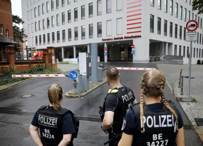 German police officers wait in front of the emergency entrance to the Charite hospital in Berlin where Alexei Navalny will be treated (Markus Schreiber/AP)