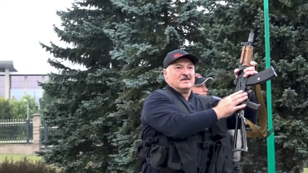 Alexander Lukashenko armed with a rifle (State TV and Radio Company of Belarus via AP)