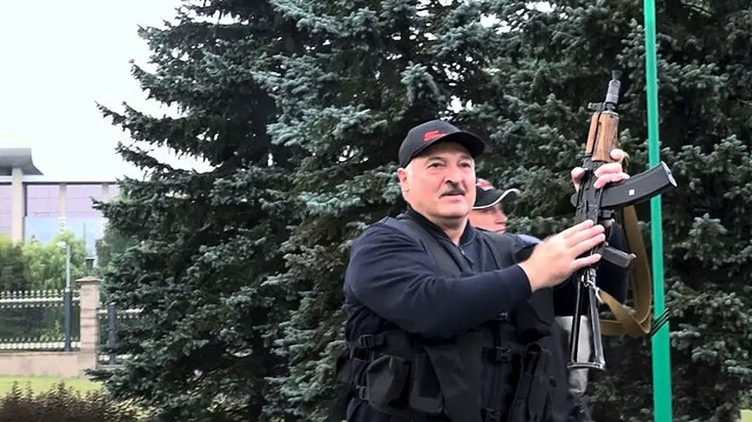 Alexander Lukashenko armed with a rifle (State TV and Radio Company of Belarus via AP)