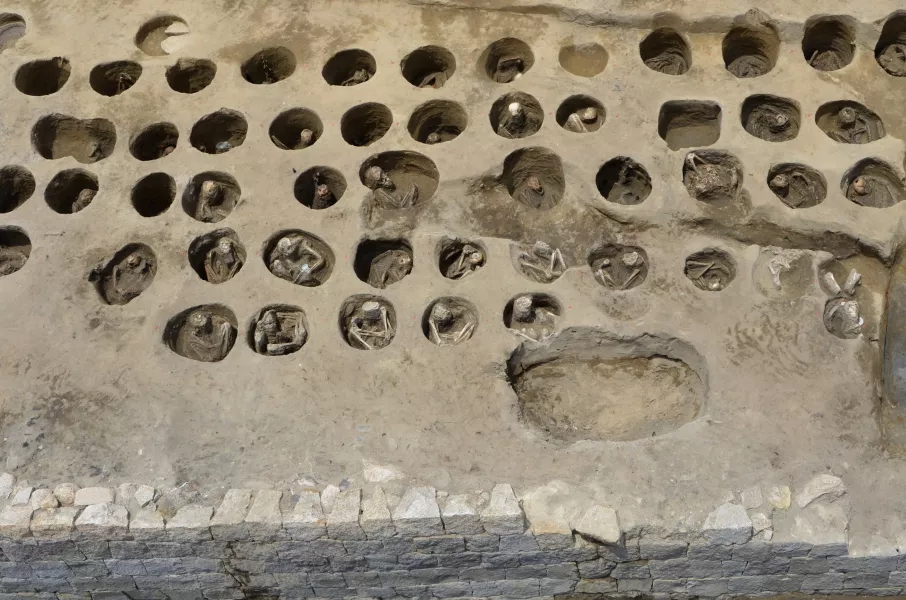 Human bones buried in holes at the burial site (Osaka City Cultural Properties Association via AP)