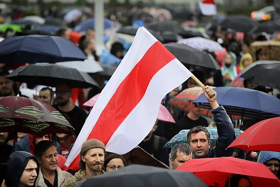 Belarusian opposition supporters protested despite heavy rain (AP/Sergei Grits)