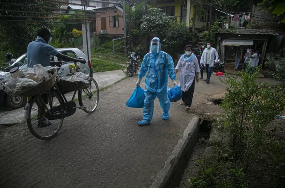 A health worker during a door-to-door drive to test for Covid-19 in Gauhati, India (Anupam Nath/AP)