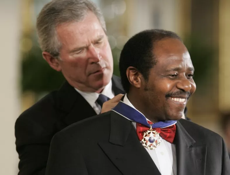 Then-US president George W Bush awarding Rusesabagina the Presidential Medal of Freedom (AP/Lawrence Jackson, File)