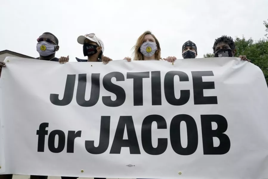 Participants in a community gathering at the site of Jacob Blake’s shooting (Morry Gash/AP)