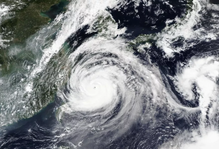 A satellite image shows Typhoon Maysak over Japan’s southernmost islands (Nasa/AP)