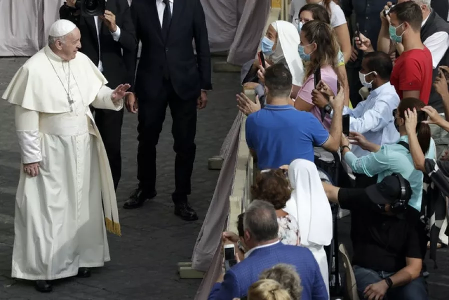 Pope Francis speaks to faithful wearing face masks (Andrew Medichini/AP)