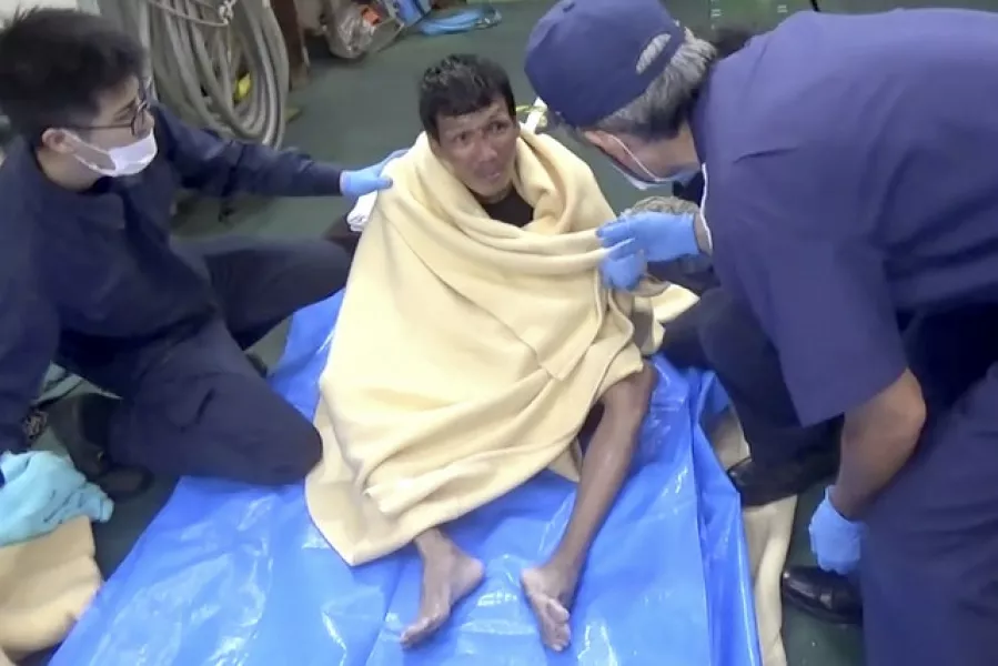 The rescued man was wearing a lifejacket (The 10th Regional Japan Coast Guard Headquarters via AP)