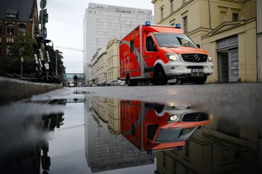 An ambulance drives in front of the central building of the Charite hospital where the Russian opposition leader Alexei Navalny is being treated (Markus Schreiber/AP)