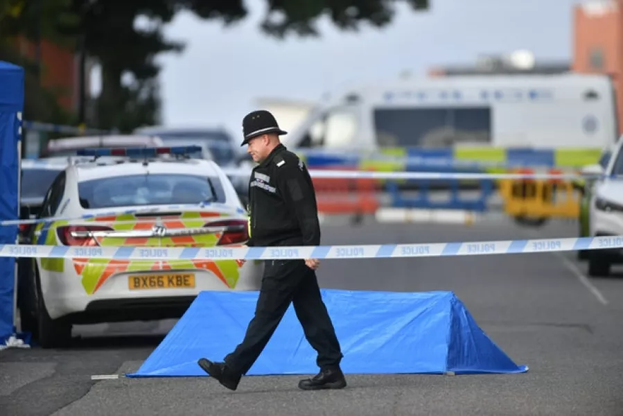 A police officer at a cordon in Irving Street (Jacob King/PA)