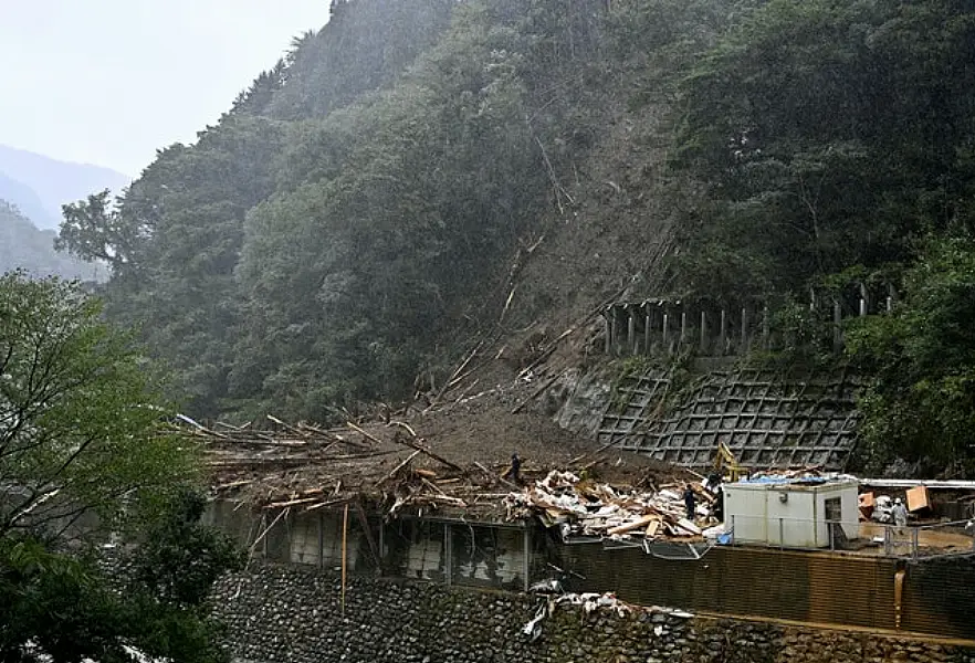 Rescuers at a mudslide site in the mountainous village of Shiiba, southwestern Japan (Ren Onuma/Kyodo News via AP)