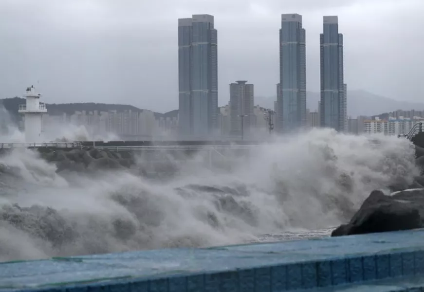 High waves crash ashore in Busan, South Korea (Son Hyung-ju/Yonhap via AP)