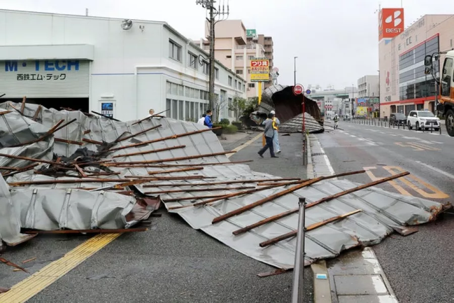 The damaged roof of a car repair garage in Fukuoka, southwestern Japan (Kyodo News via AP)