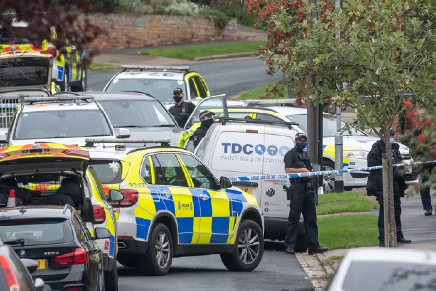 Armed police officers outside a property on Westwood Avenue, Ipswich (Joe Giddens/PA)