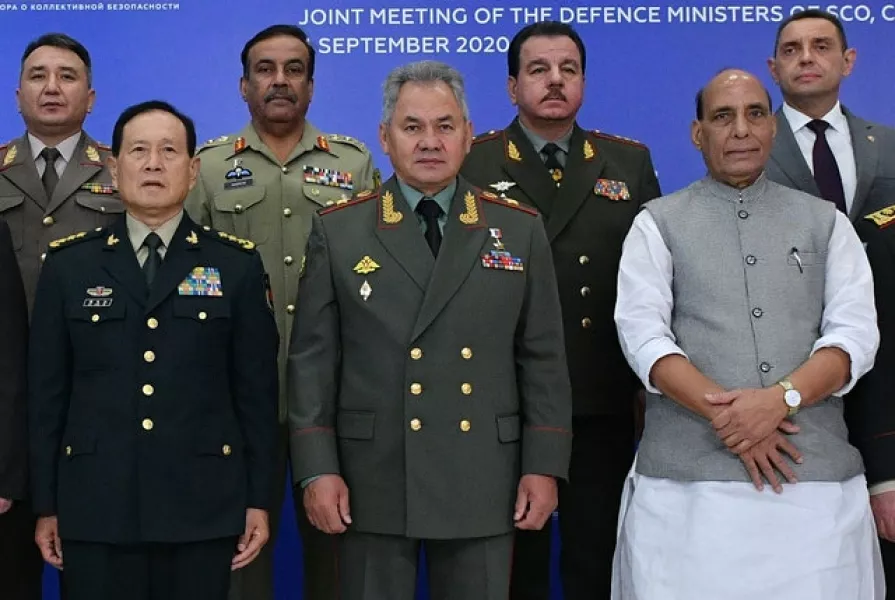 China’s minister of national defence Wei Fenghe, left, Russian defence minister Sergei Shoigu, centre, and Indian defence minister Rajnath Singh at a meeting in Russia (Ramil Sitdikov/ Host Photo Agency sco-russia2020.ru via AP)