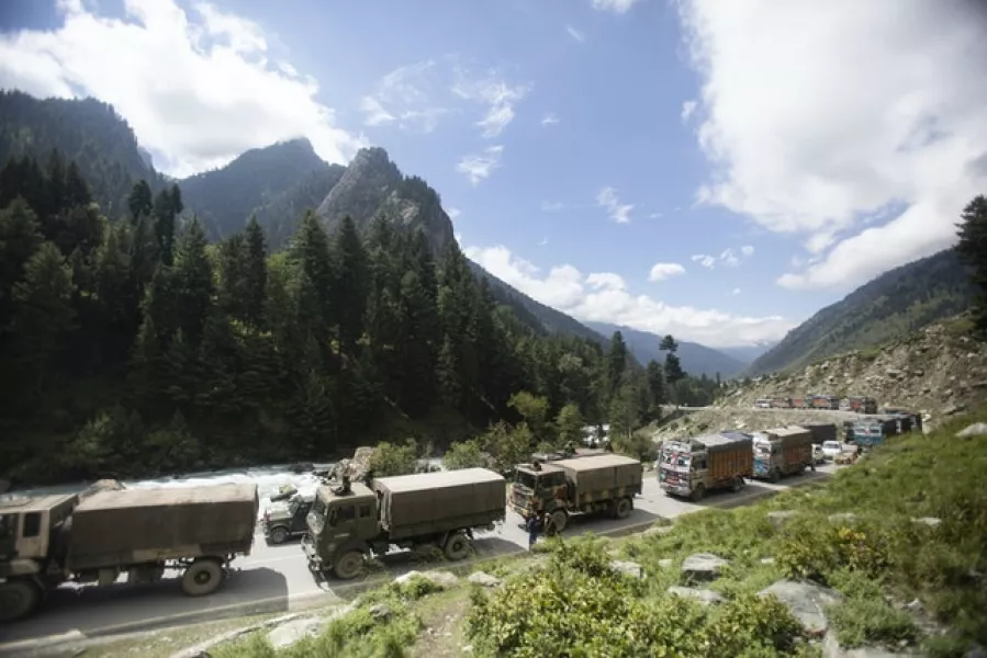 An Indian army convoy at Gagangeer, north east of Srinagar (Mukhtar Khan/AP)