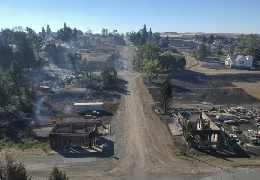 Smouldering buildings in Malden, Washington (Jesse Tinsley/The Spokesman-Review via AP)