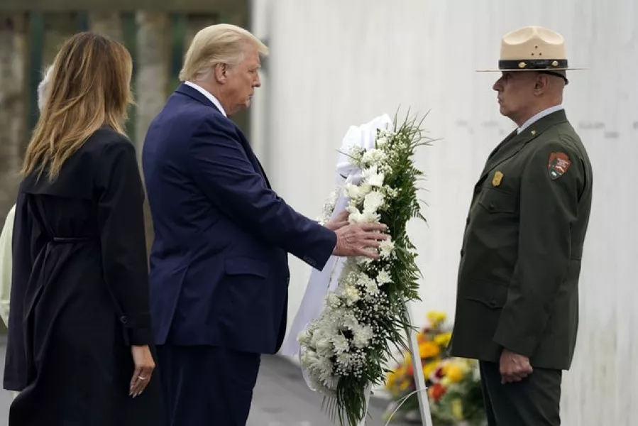 President Donald Trump lays a wreath (Alex Brandon/AP)