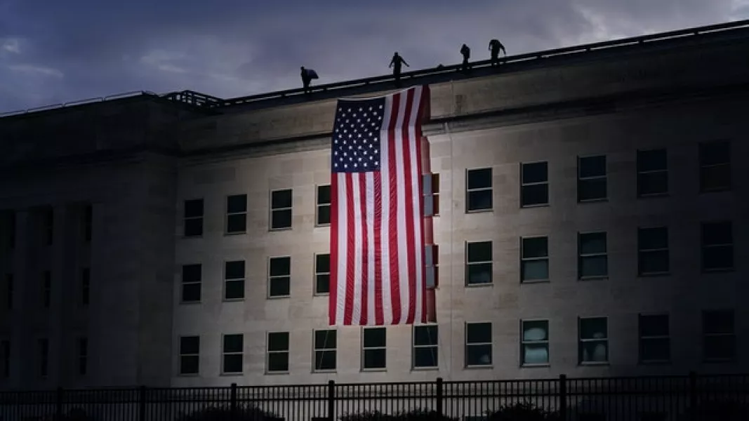 A large American flag is unfurled at the Pentagon ahead of ceremonies to mark 9/11 (J Scott Applewhite/AP)
