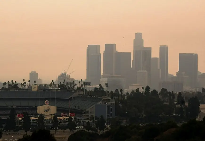 Downtown Los Angeles and Dodger Stadium are shrouded in smoke from the Bobcat and the El Dorado fires (Keith Birmingham/The Orange County Register/AP)