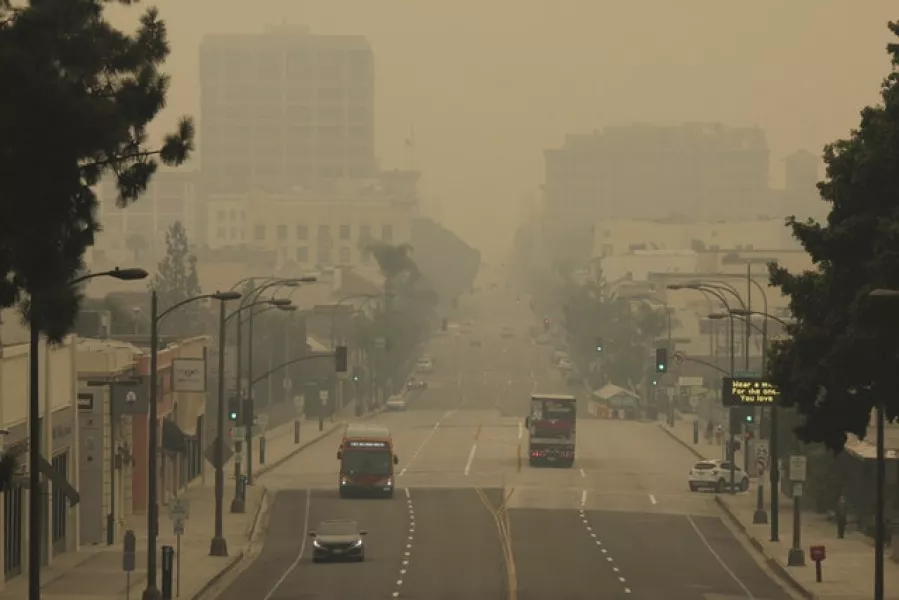 Smoke from wildfires fills the sky over Pasadena in California (John Antczak/AP)