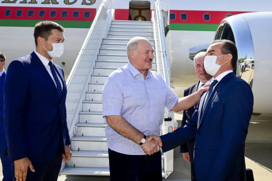 Belarus President Alexander Lukashenko greets officials on arrival in Sochi (Andrei Stasevich/BelTA/AP)