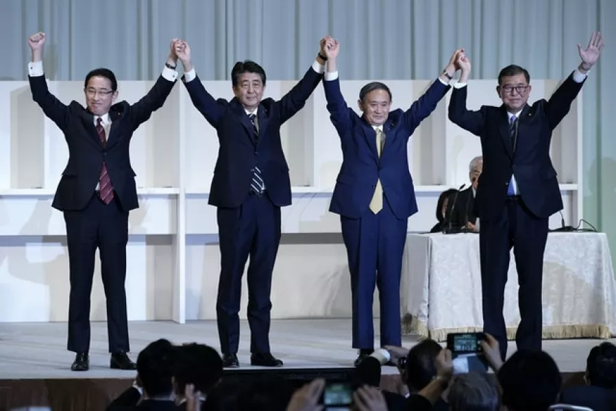 Former foreign minister Fumio Kishida, prime minister Shinzo Abe, cabinet secretary Yoshihide Suga and former defence minister Shigeru Ishiba (AP)