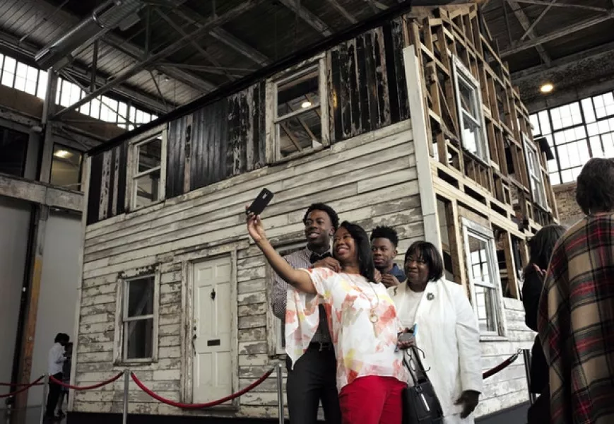 Visitors to the rebuilt house of Rosa Parks in the US (Steven Senne/AP)