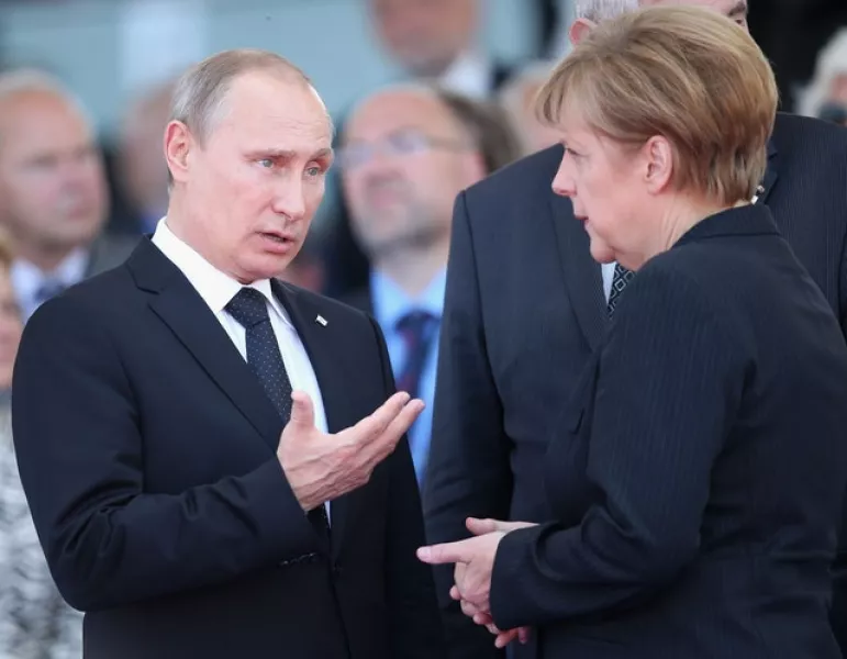 Vladimir Putin and Angela Merkel (Chris Jackson/PA)