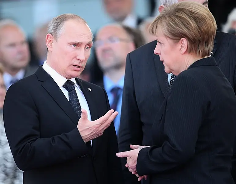 Vladimir Putin and Angela Merkel (Chris Jackson/PA)