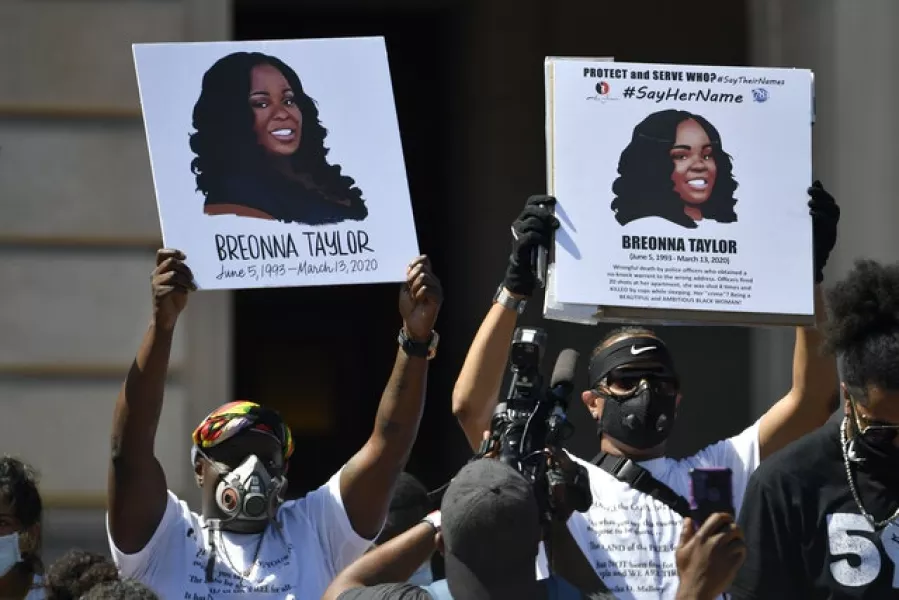 A rally in honour of Ms Taylor (Timothy D Easley/AP)